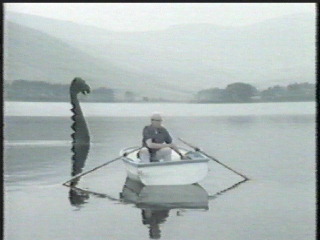 arthur in loch ness with monster
approaching