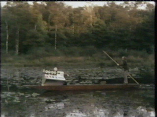 Graeme and computer in a boat on the
lake of love